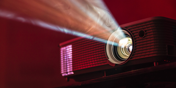 Projector, up close, in an dark red light